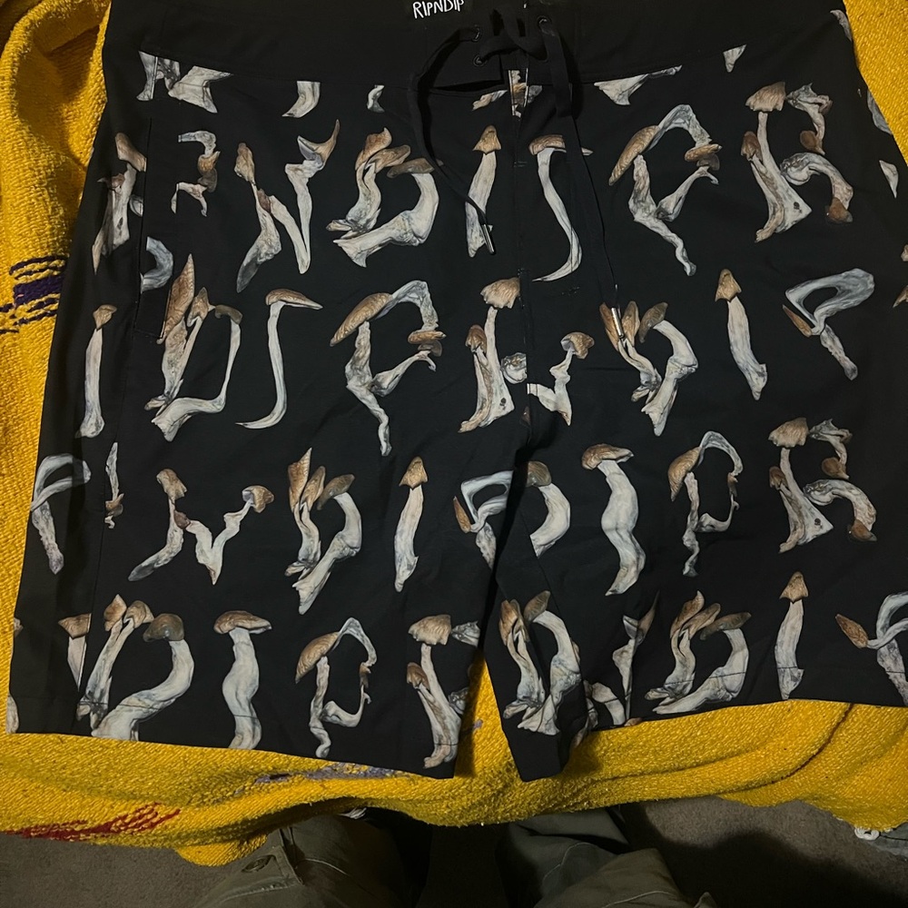 Black Rindip Board Shorts with Mushroom Logo.
